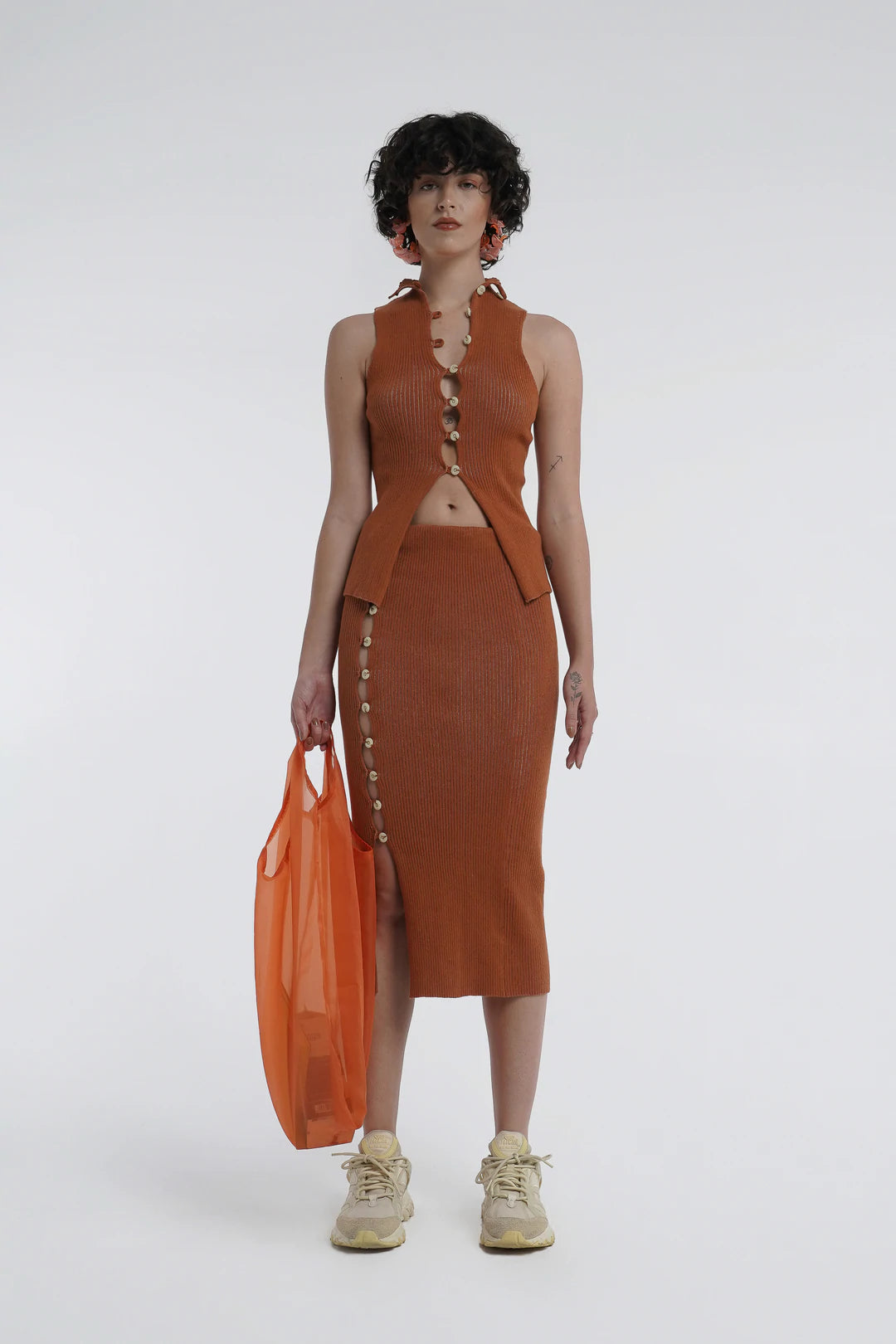 Kick up skirt in tobacco with button side detail.