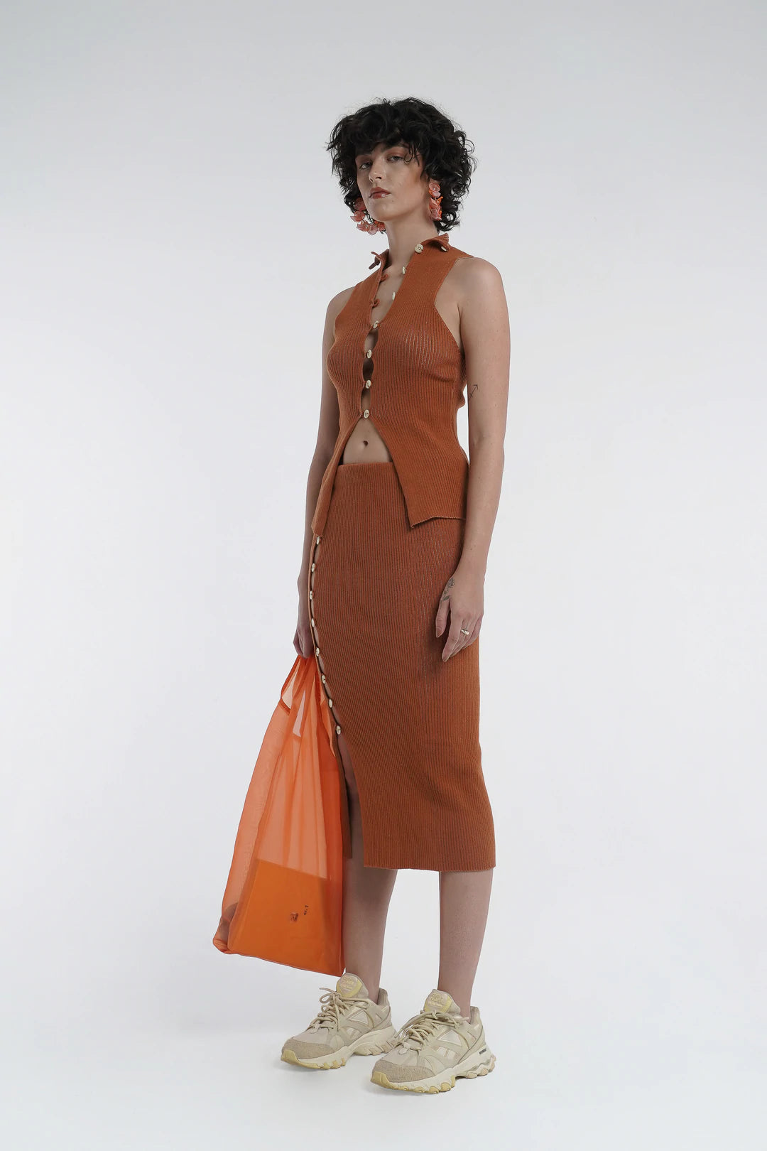 Kick up skirt in tobacco with button side detail.