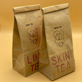 masha tea in variation "skin tea" and "love tea" depicted in packaging 