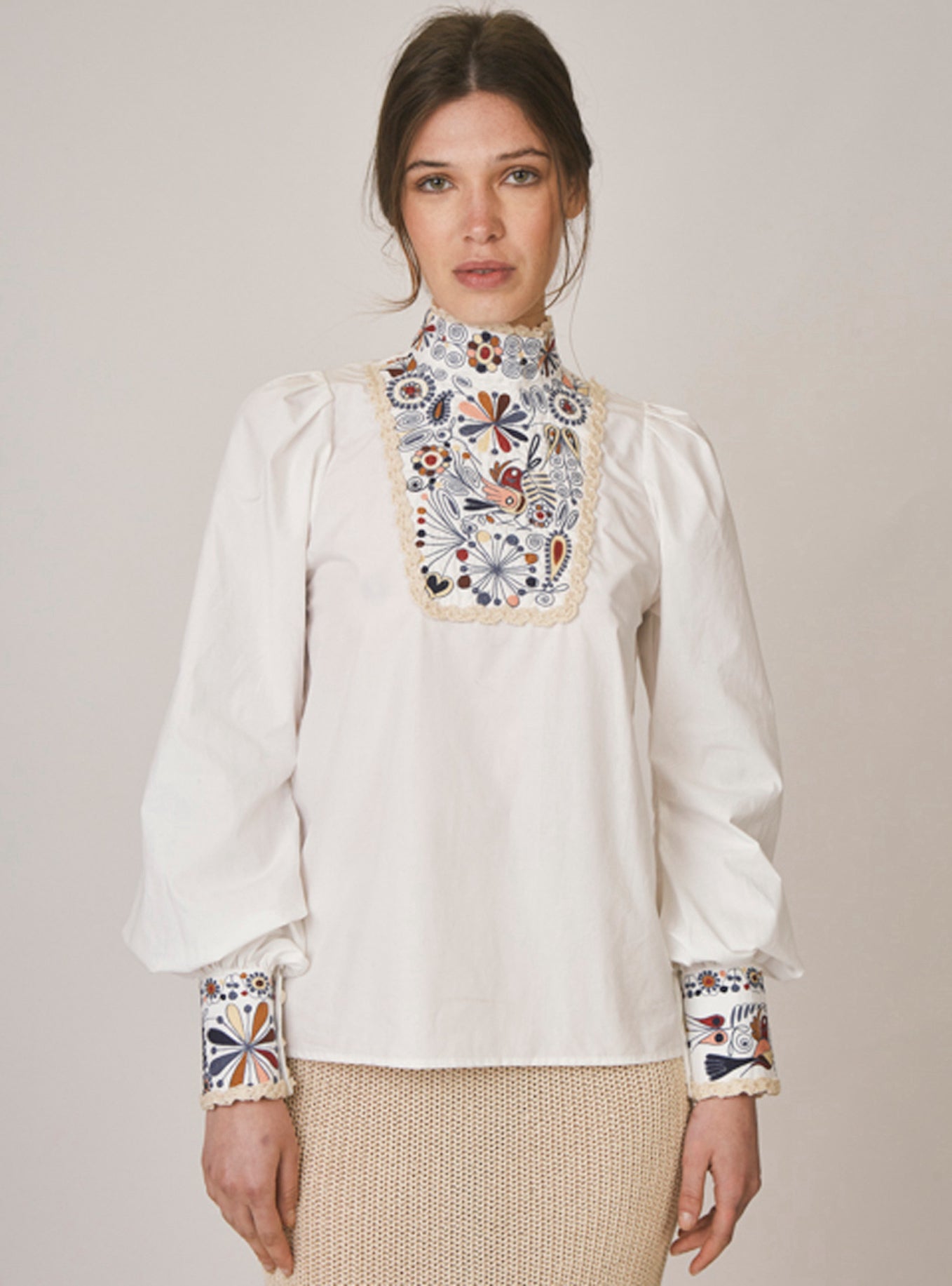 mock turtle neck floral shirt worn by model 