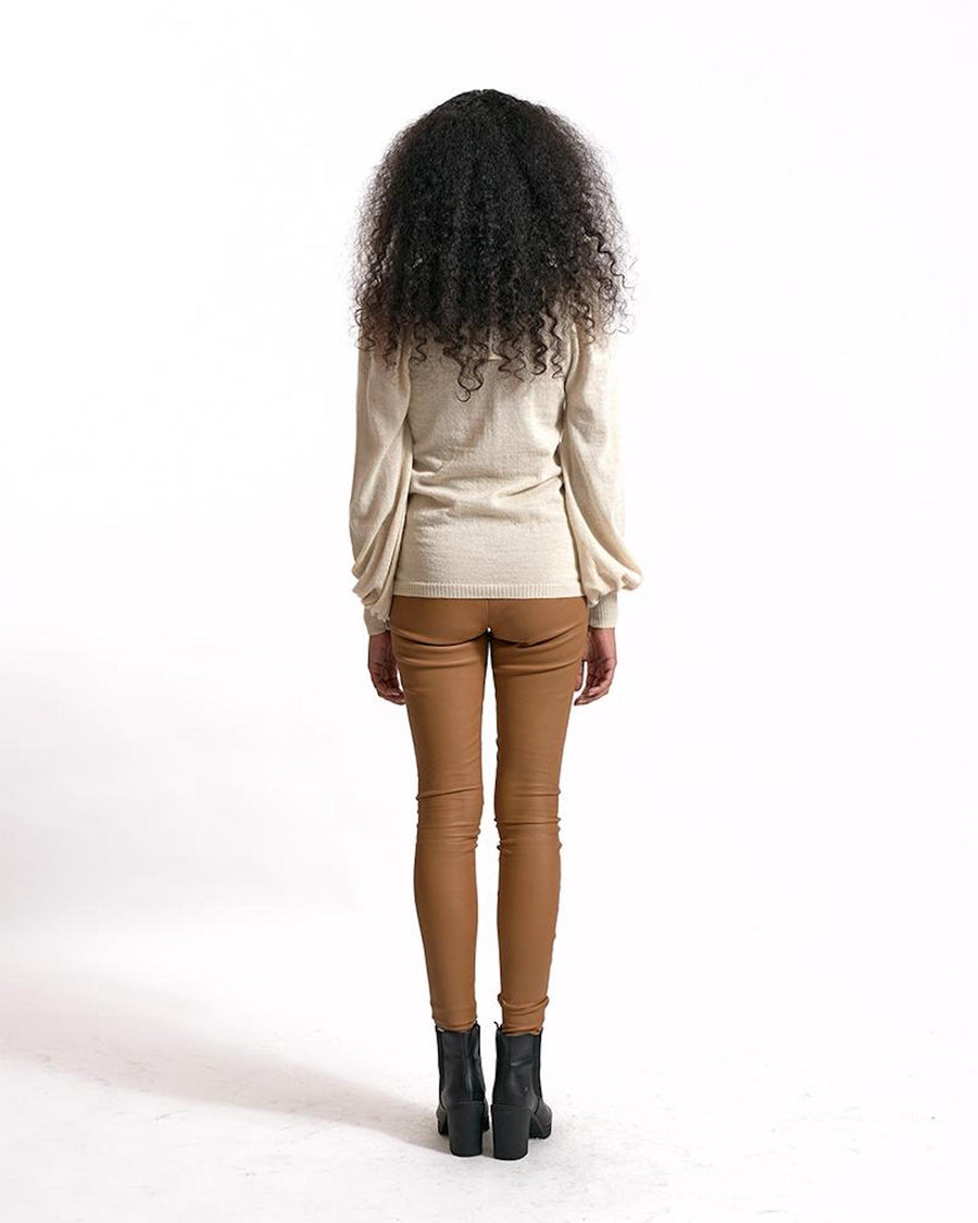 ivory shirt worn by model from the back 