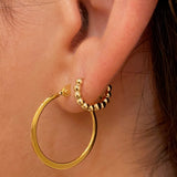 huggie earrings on model 