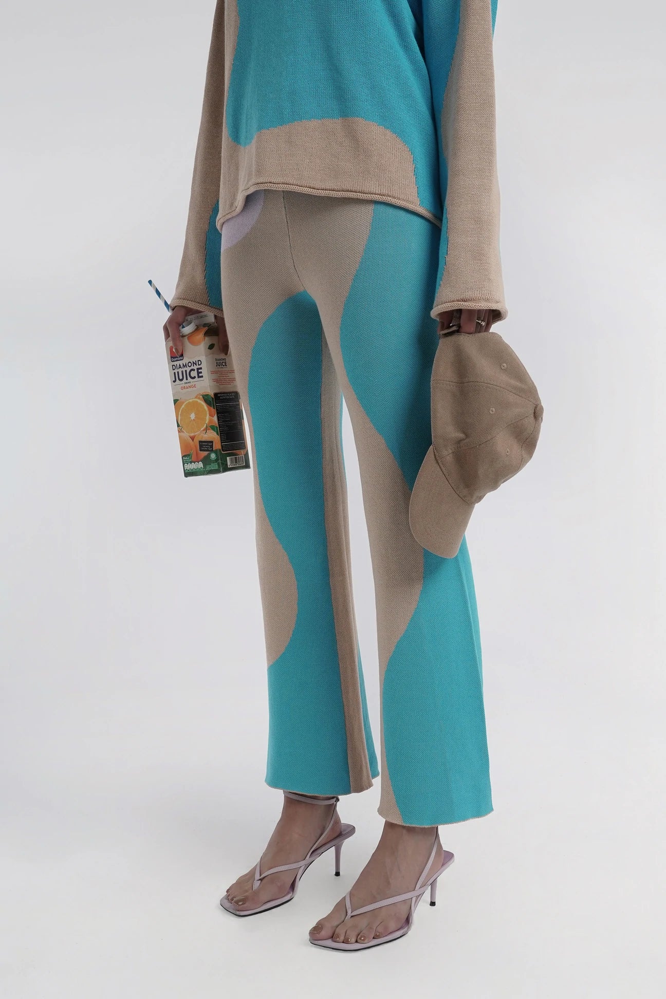 woman wearing wavy blue knit pants